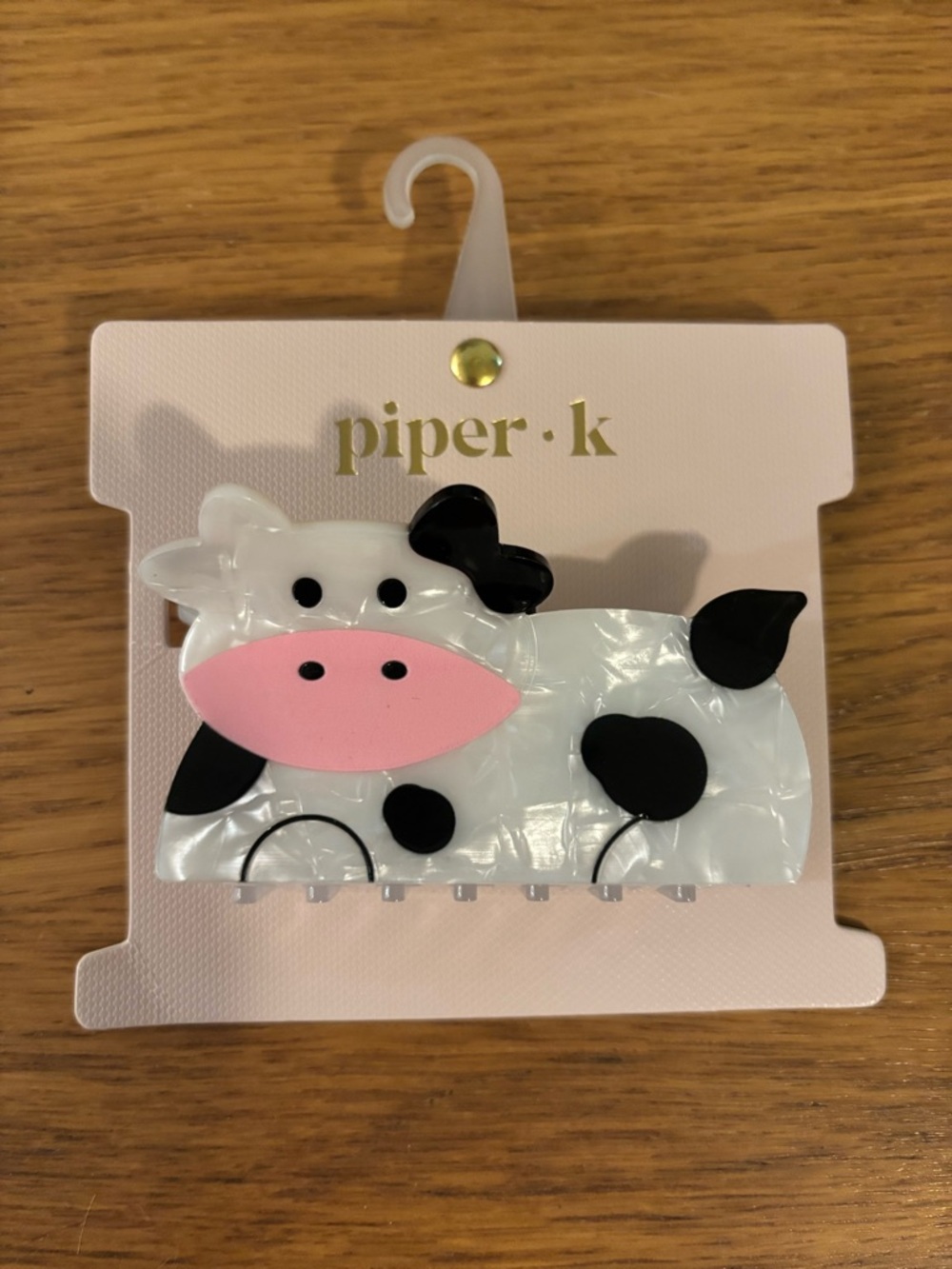 Piper K cow claw hair clip features a whimsical cartoon cow New